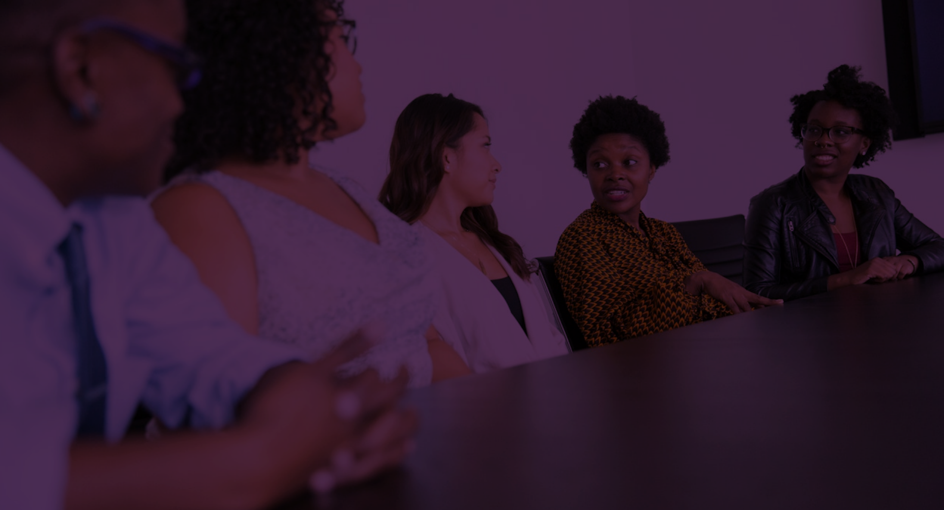 Diverse group discussing around a table